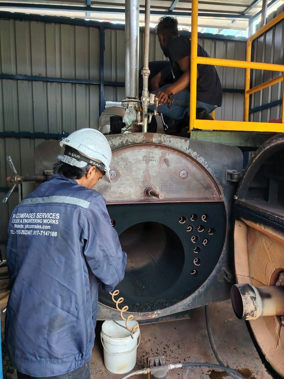 PK Comrades technician carrying out annual boiler overhaul and firetube cleaning for JKKP inspection in Malaysia