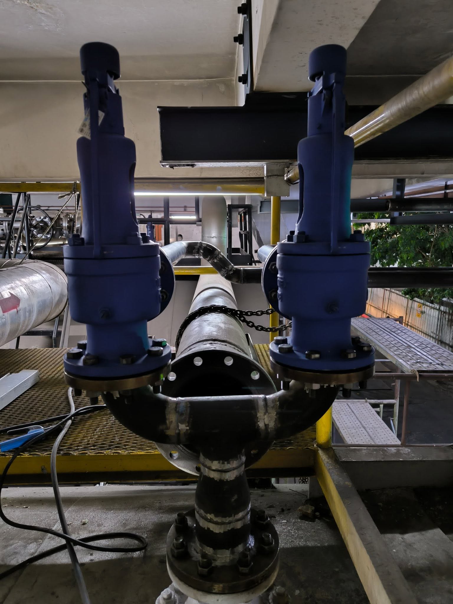 Completed twin single-port boiler safety valves mounted on Y-manifold at Malaysian oil refinery