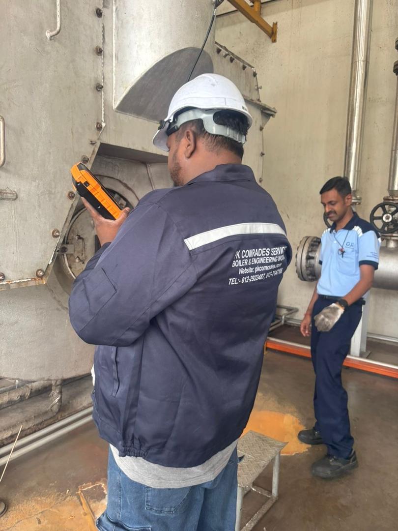 Technician performing industrial burner commissioning, tuning and troubleshooting in Malaysia