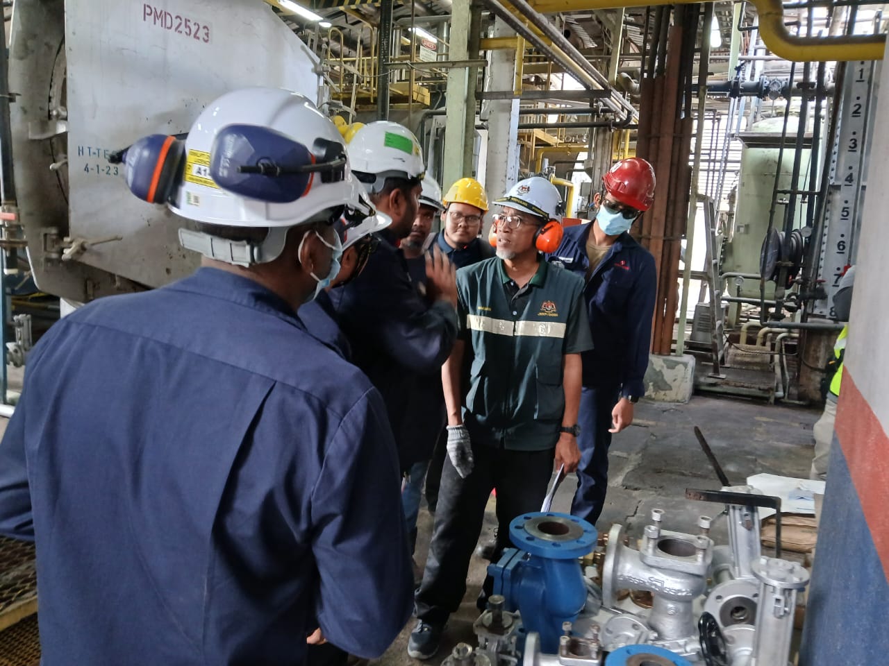 PK Comrades technicians attending a JKKP-officer-led boiler inspection at an industrial plant in Malaysia