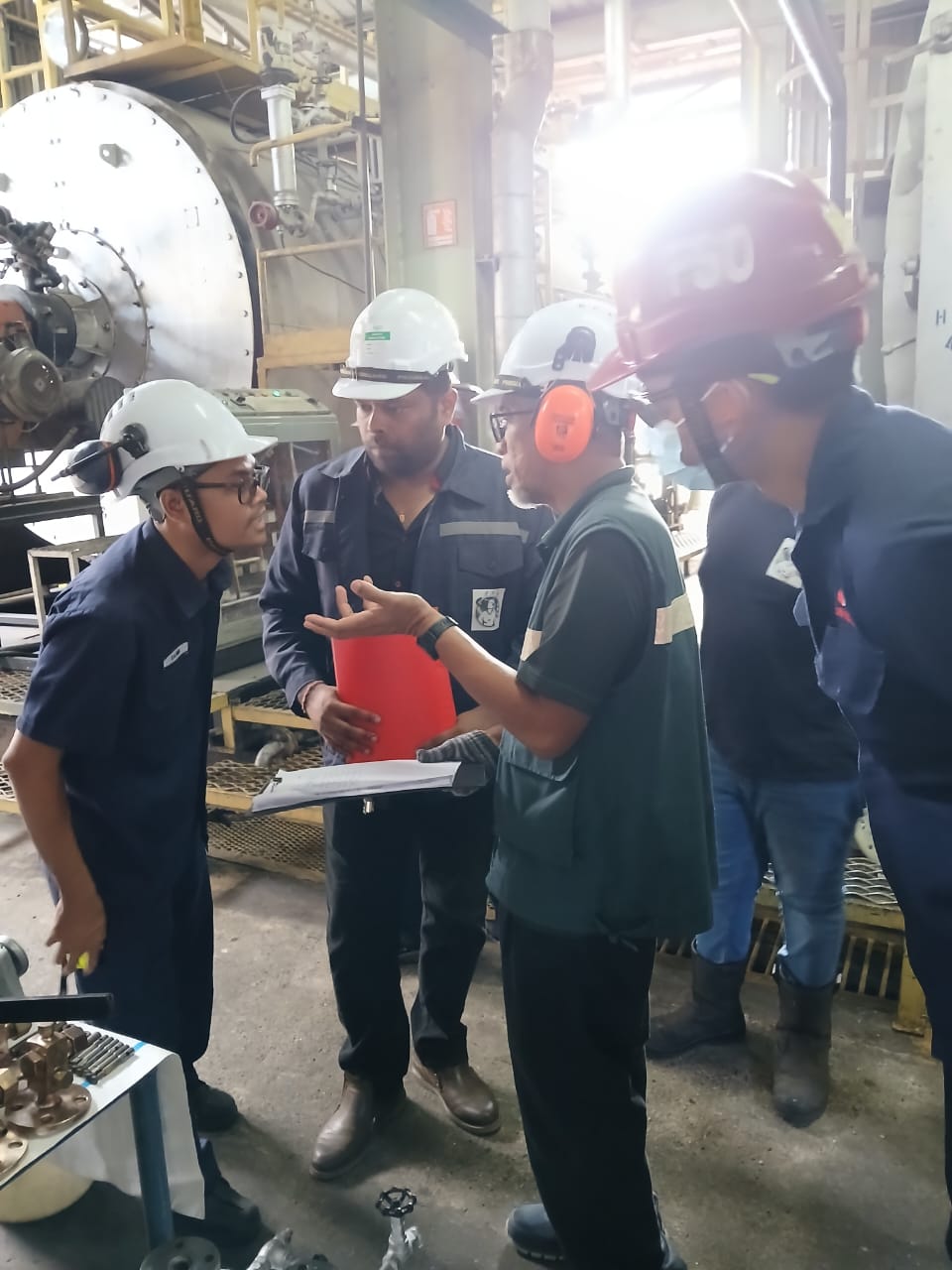 JKKP-certified inspector briefing the PK Comrades technicians during a boiler safety inspection in Malaysia