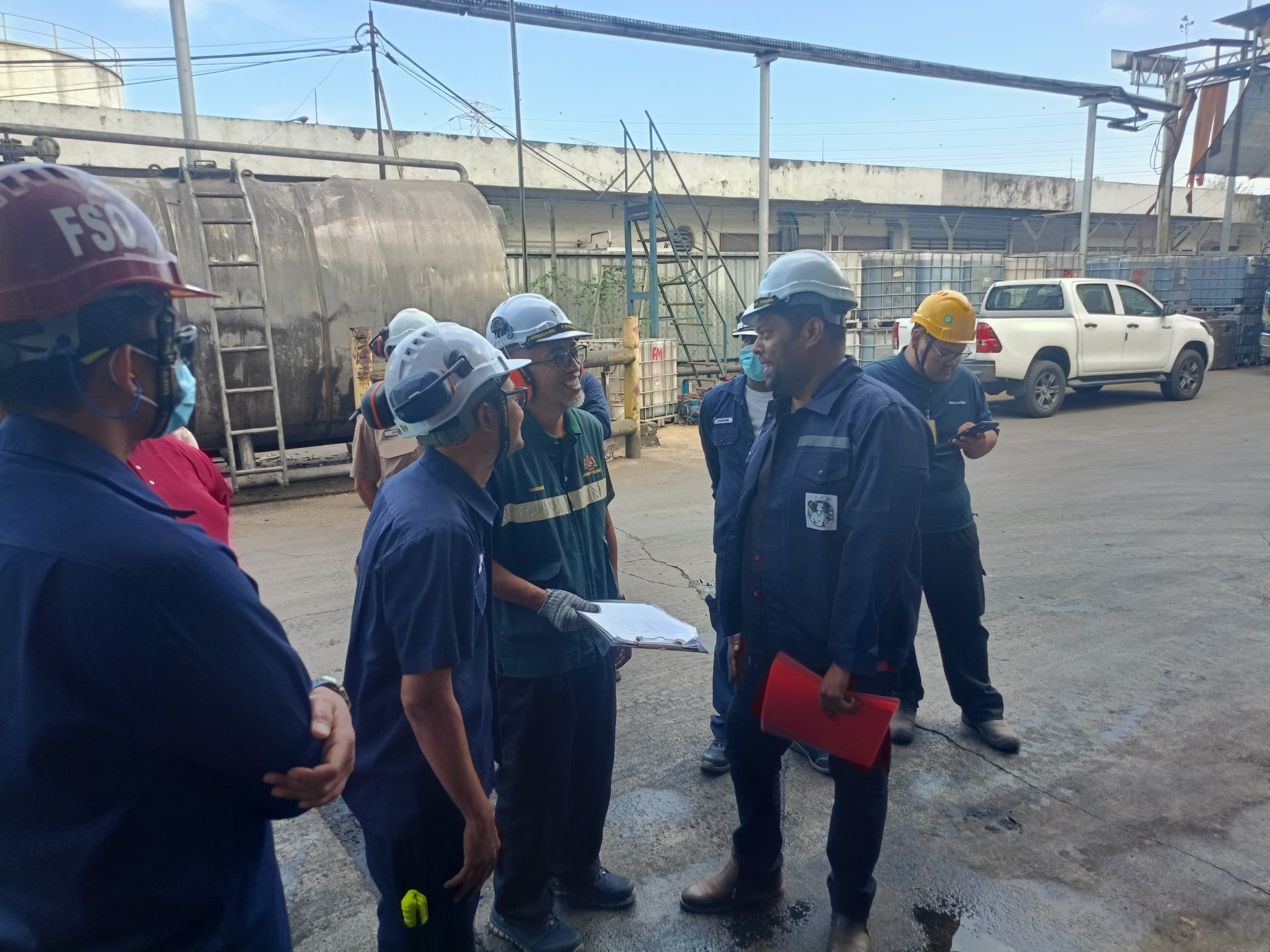 JKKP officer conducting an on-site safety audit with the PK Comrades engineering team at a Malaysian industrial facility