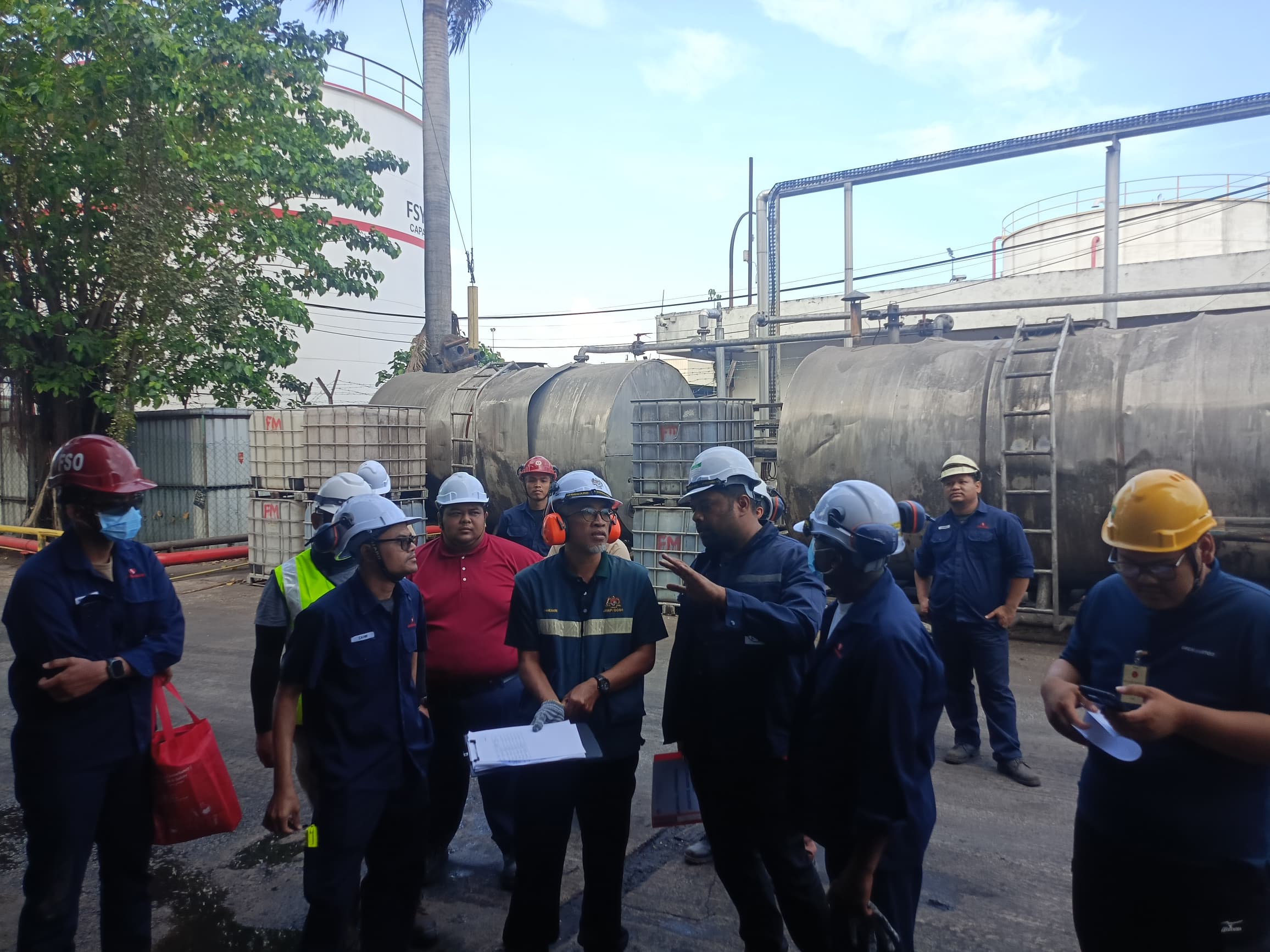 PK Comrades engineering team with the JKKP inspector during an industrial boiler audit in Malaysia